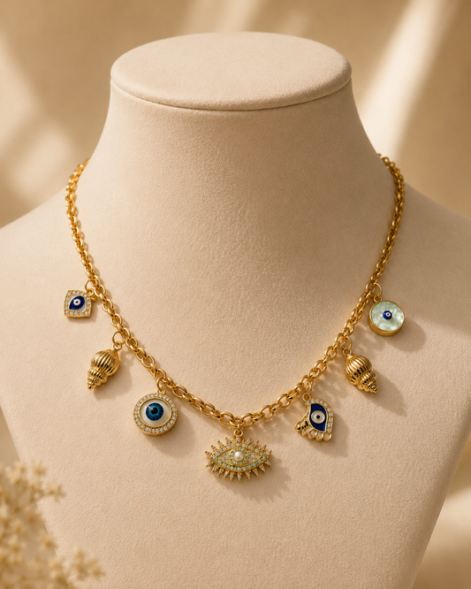 vrenora-evil-eye-gold-charm-necklace-on-display-bust.png